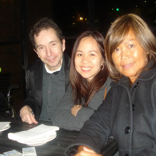 3 people at a table at a fundraising event<br />
